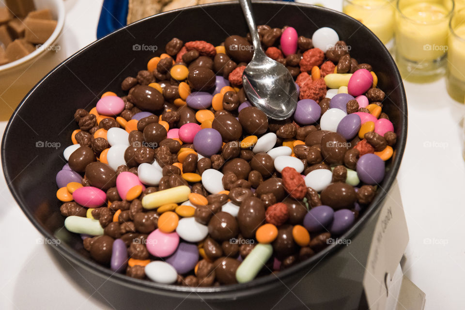 Candy in a bowl on a table.