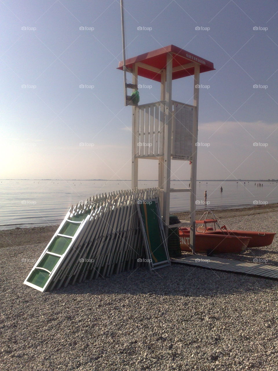 in the beach, lifeguard salvamento, deck chairs