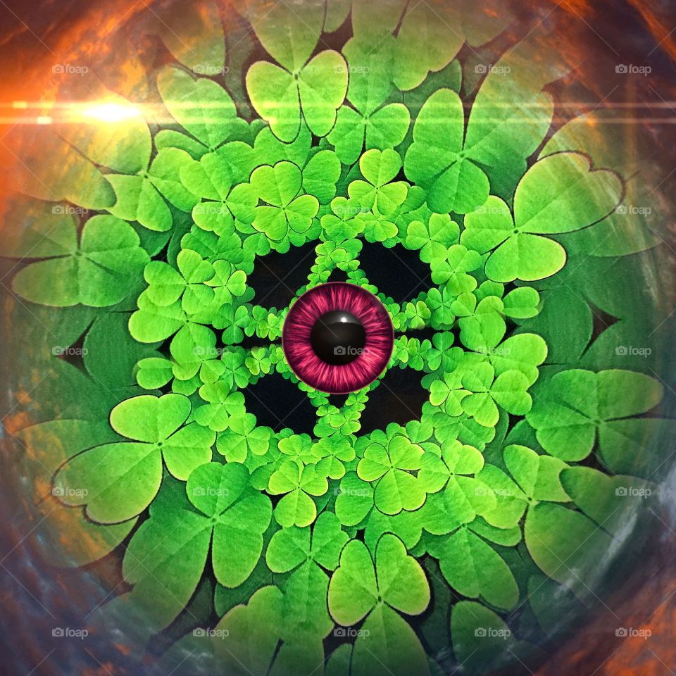 Red eye and green clover abstract.
