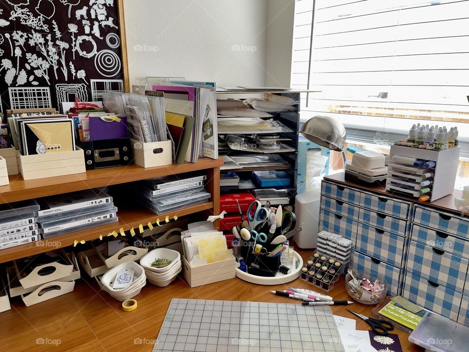 Desk with art supplies for scrapbooking 