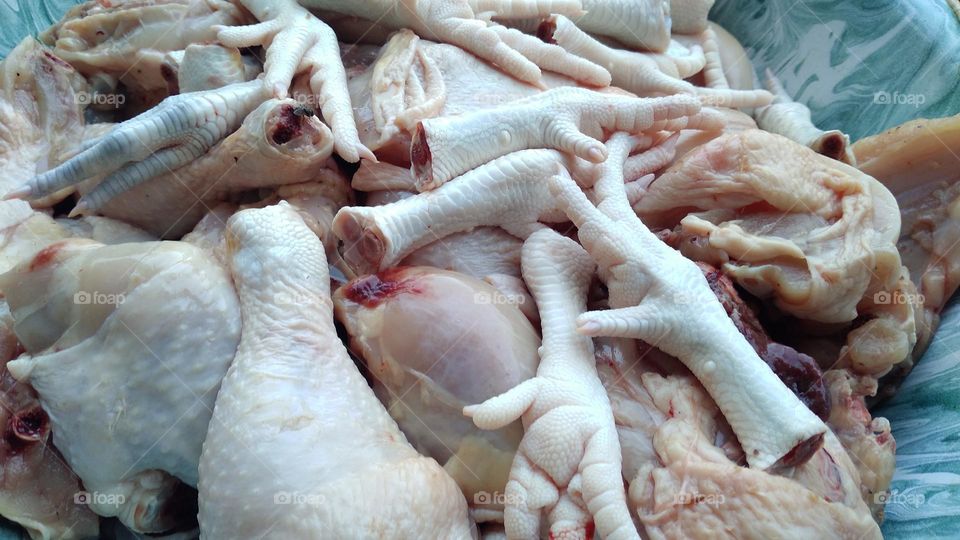 Chicken pieces that are ready to be processed for cooking