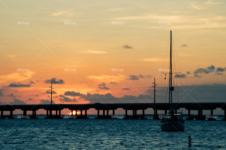 amazing sunset behind Overseas highway bridge Florida Keys US route 1, copy space dusk golden hour 