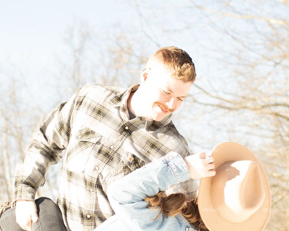 His forever girl, man with facial hair dipping a woman in an outdoors dance