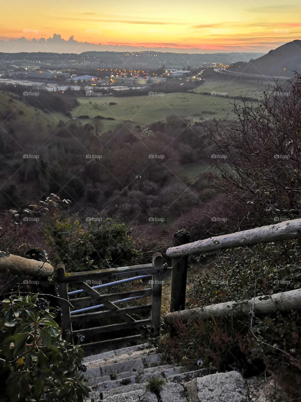 Sunset over the hills and stairs path