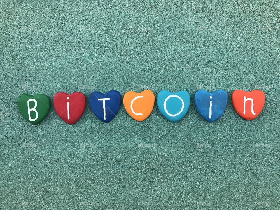 BTC, Bitcoin, worldwide cryptocurrency and digital payment system with colored heart stones