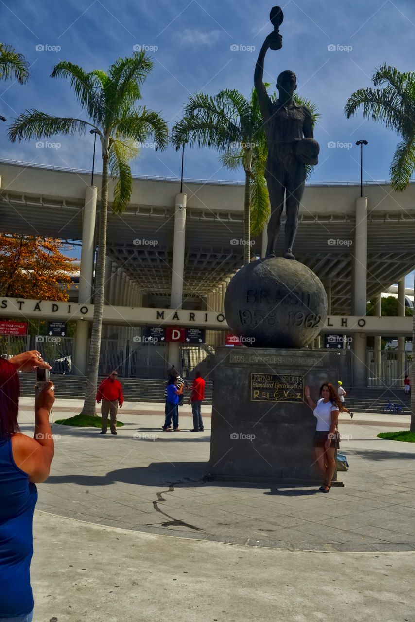 Woman standing near statue