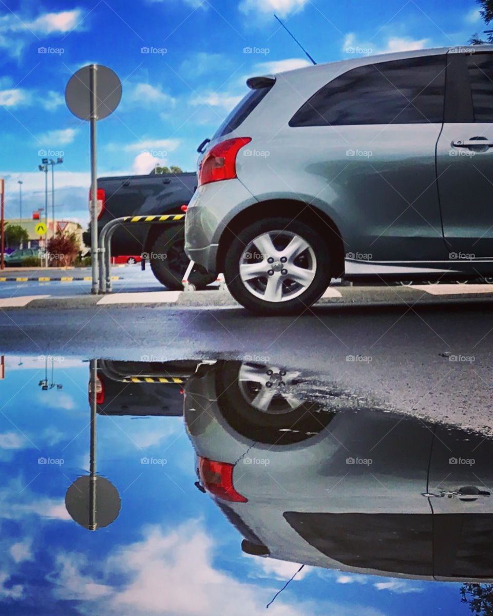 Having fun with a puddle and a camera