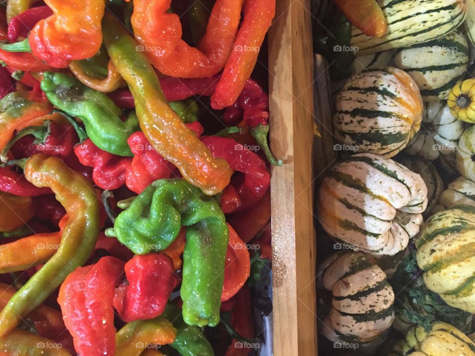 Full frame shot of pumpkins and chillies