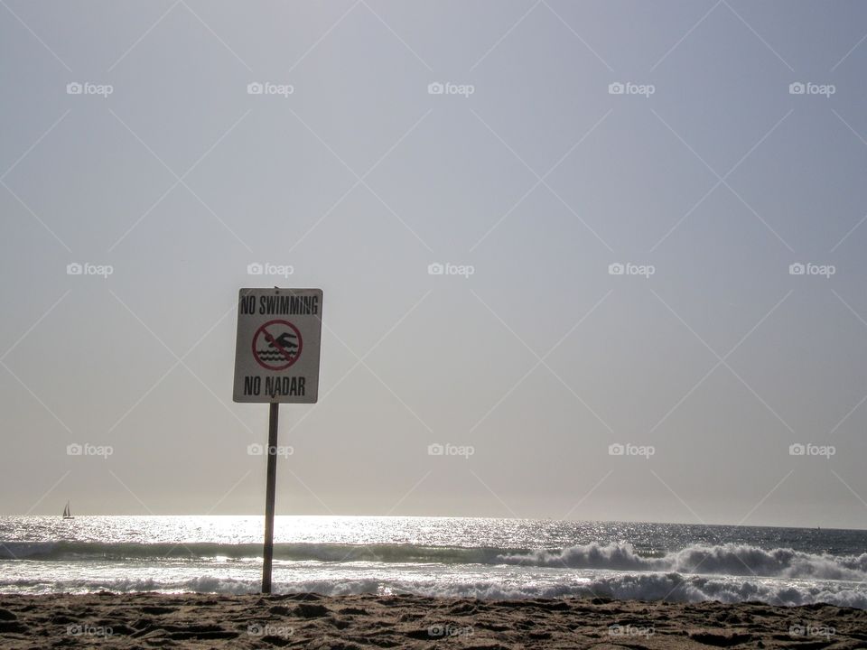 No swimming sign on beach