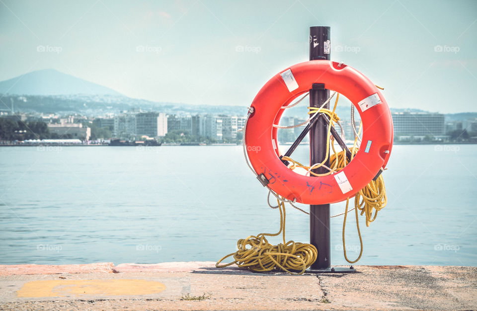 Orange Lifebuoy At Port