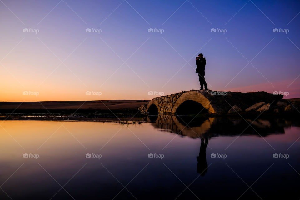 Taking photograph in sunset