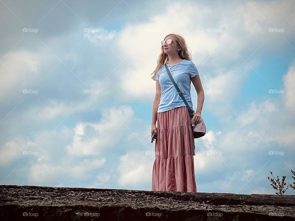 A blonde woman enjoying the views from Buzzard Rock in Whitley City in Kentucky 