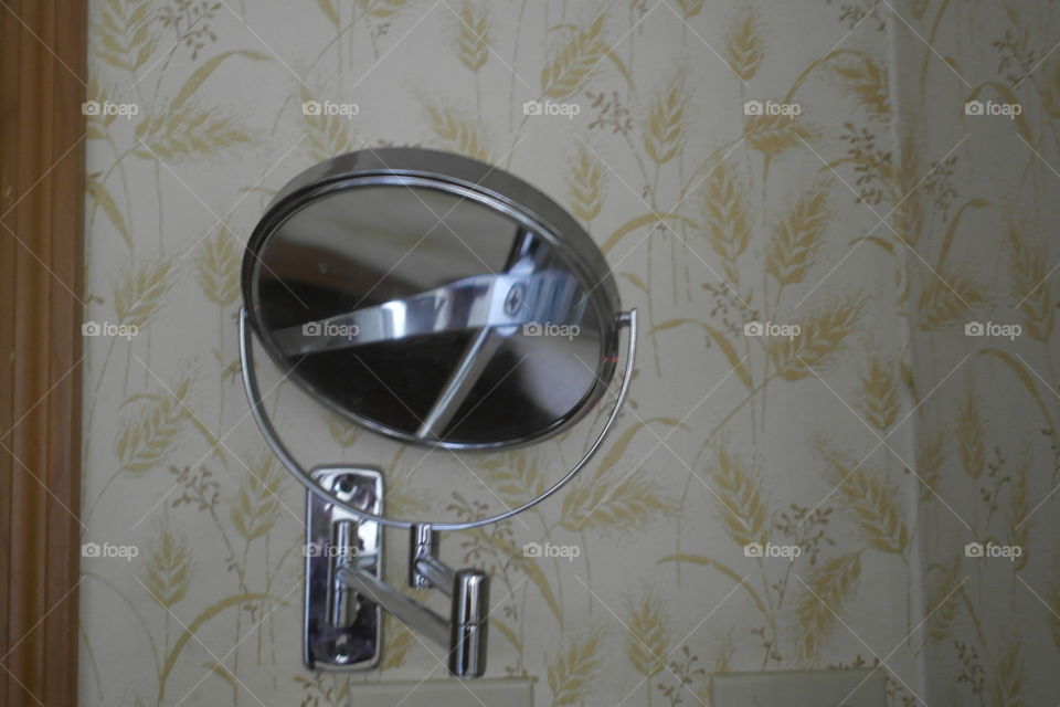 Round vanity mirror on the wall 