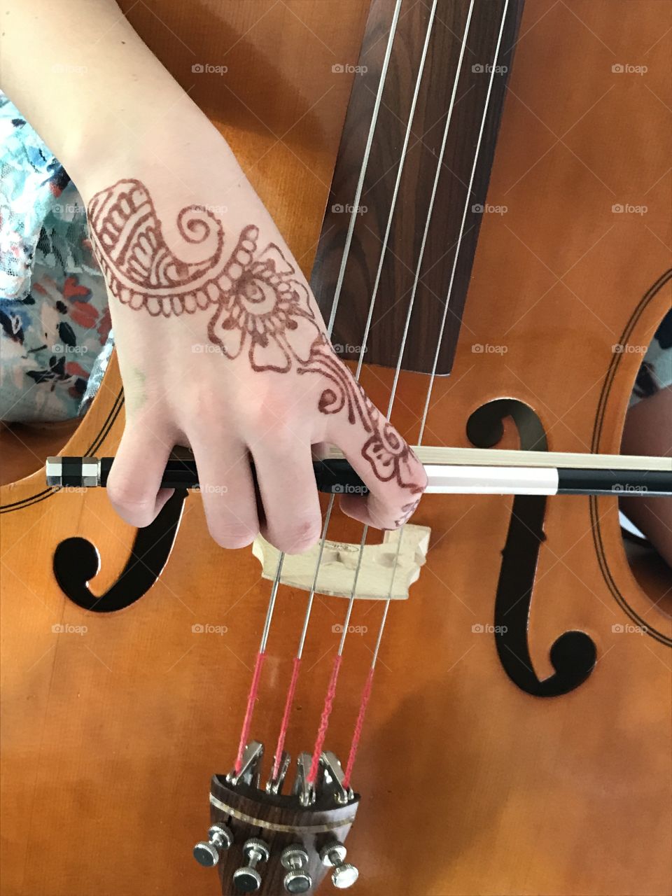 The beauty of music: my amazing pre-teen daughter was practicing her cello for an audition today and the beauty of her hand with the flowery details of henna tattoo set against the slick, smooth lines of the bow and body of the cello struck me as needing to be photographed and shared. Enjoy!