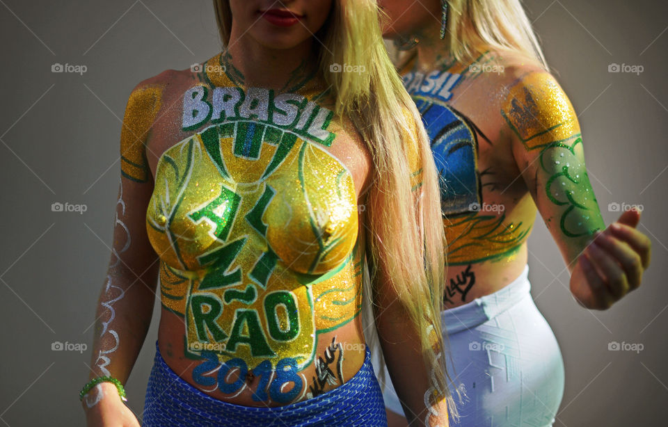 Bodypainted fans gather to watch a FIFA World Cup Russia 2018 football match between Brazil and Costa Rica.