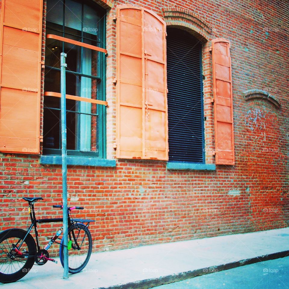 Red wall with a bike