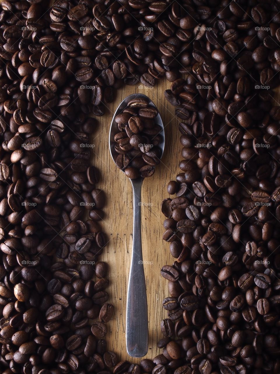 coffee beans on a spoon. coffee beans on a spoon