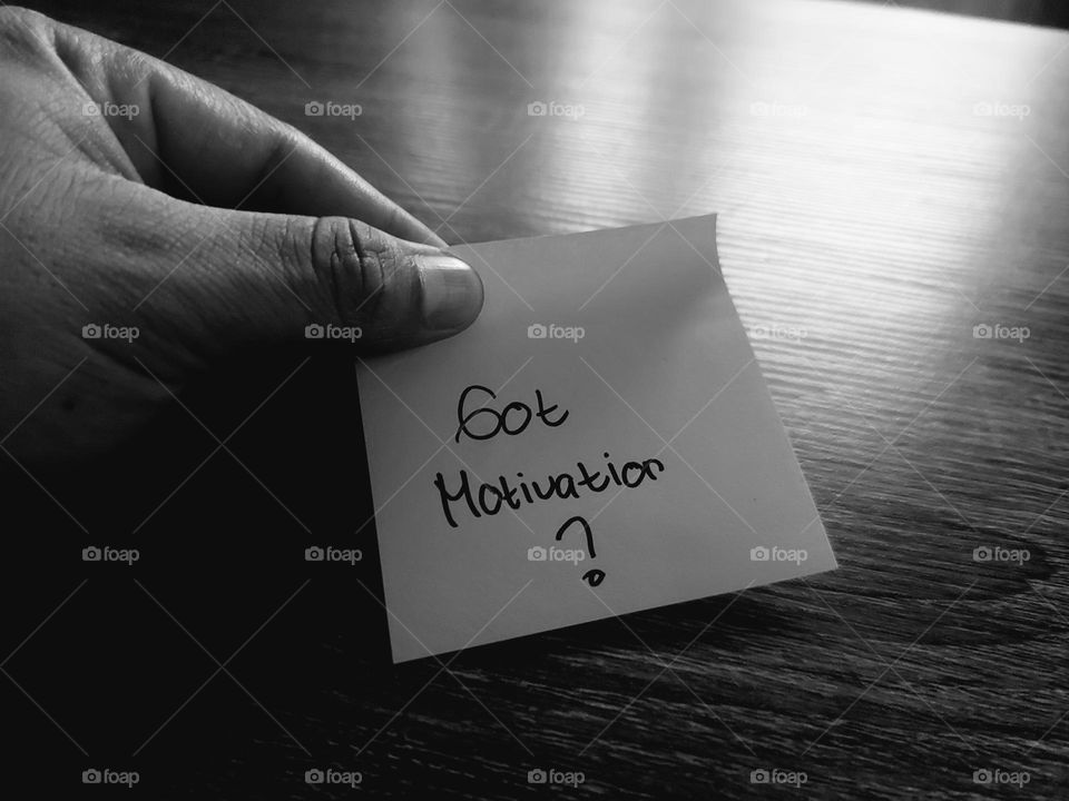 Motivational quotes on a small piece of paper