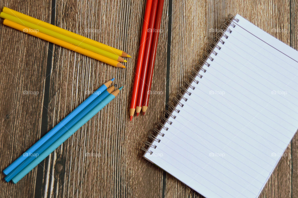 Colorful pencils and notebook