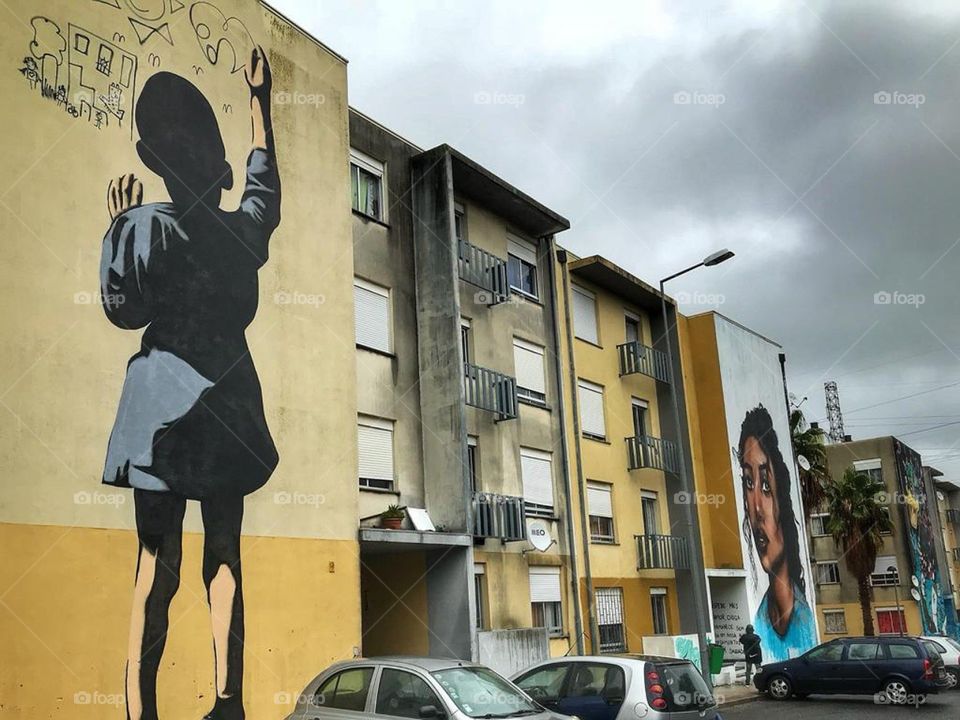 Street art, Portugal. 
Child and young lady.