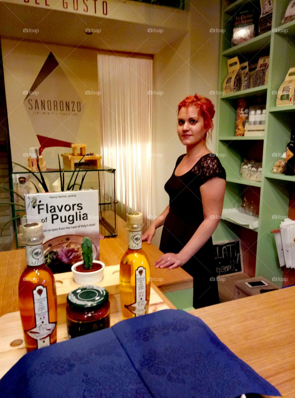 Receptionist standing in black dress