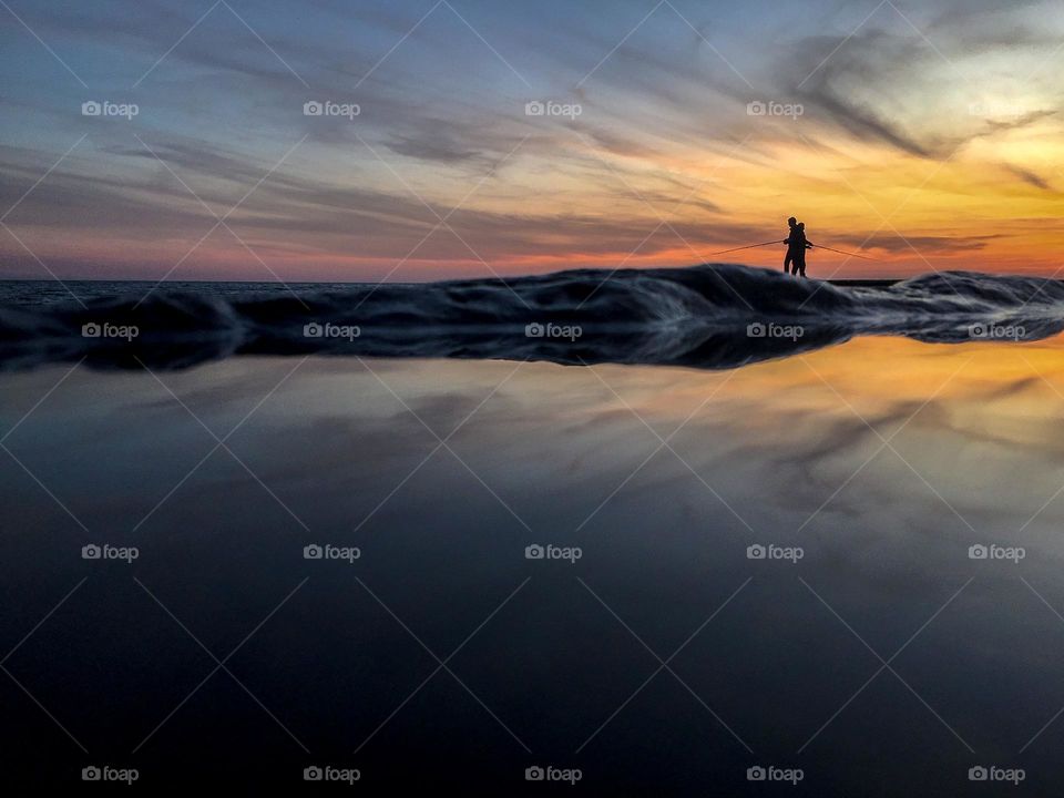 Fishermen fishing at sunset. 2018, Crimea, Ukraine.  @linallomakina