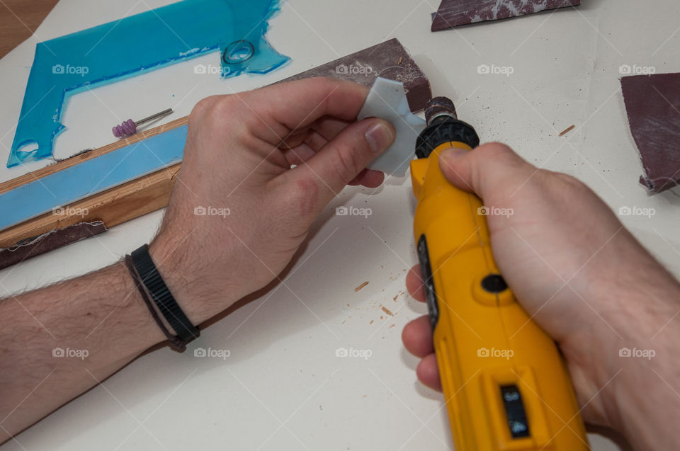 Hand crafting a piece of plastic