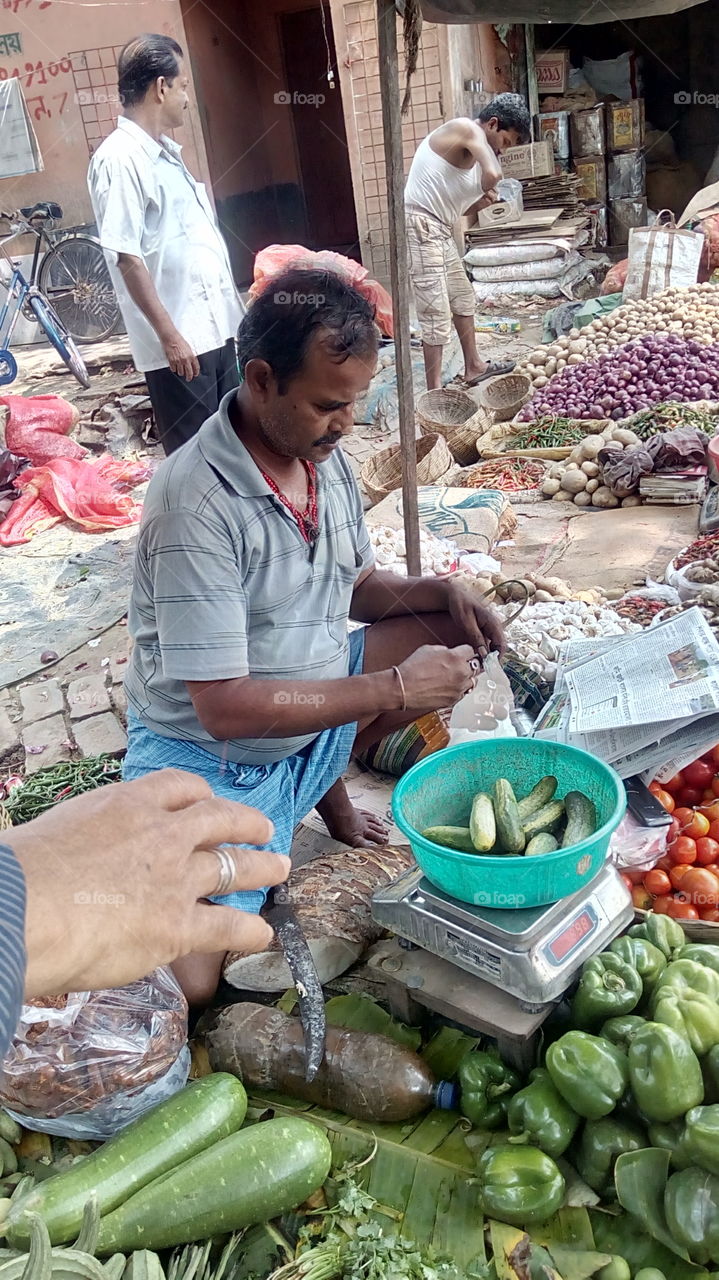 vegetable seller in market.