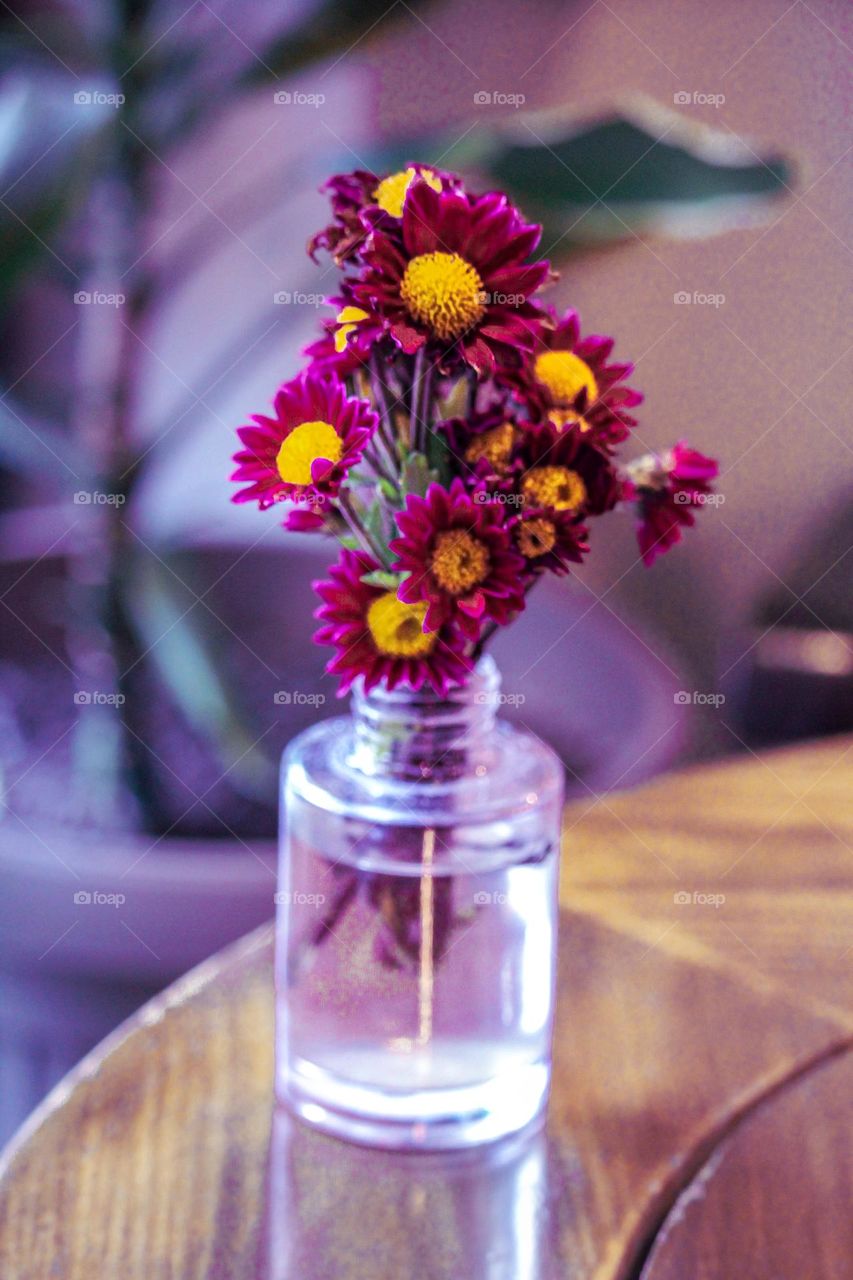 A bouquet of flowers in a bottle