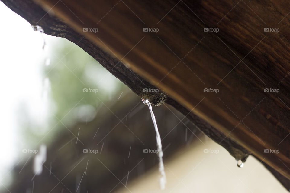Water flows from the roof, rainy season
