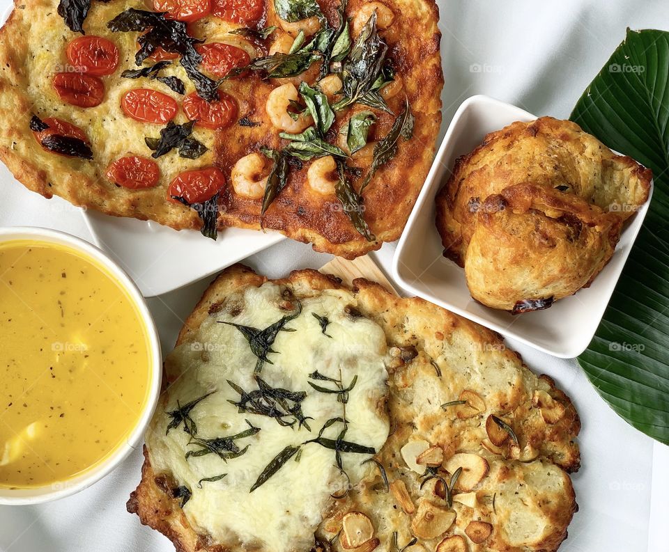 Healthy focaccia flatbread in assorted flavours and sardine mini calzone with butternut squash soup