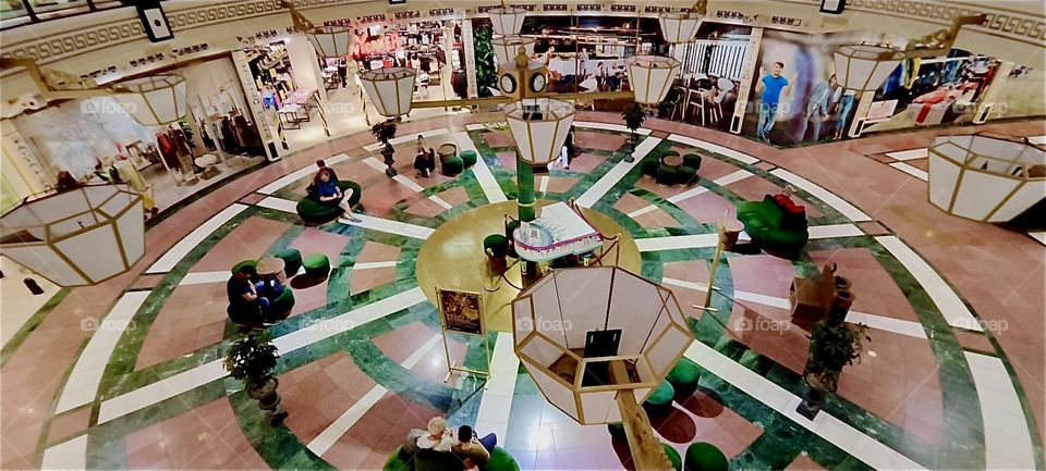 The circular arrangement of “das Schloss”, “the Castle”, a popular multistory shopping mall in “Berlin”, capitol of Germany in the “Steglitz” district displays cosmopolitan chic with a touch of modern art. 2024. Hypnotic Productions