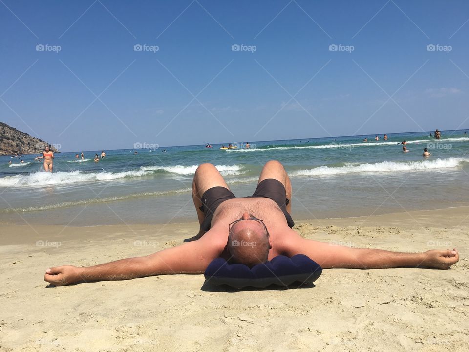 Man enjoying the sun at the beach