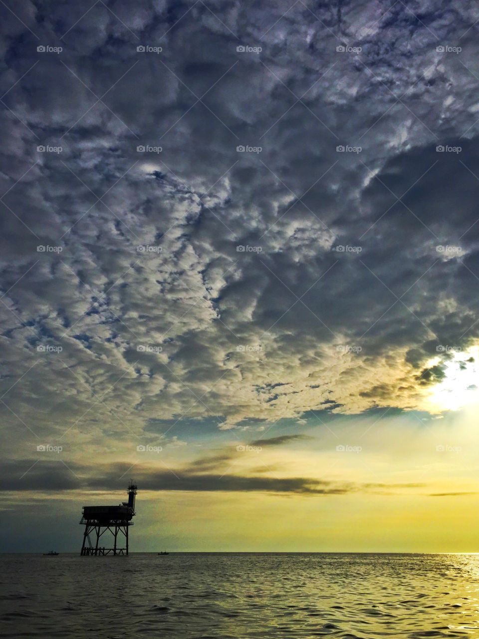 Silhouette of lighthouse during sunset