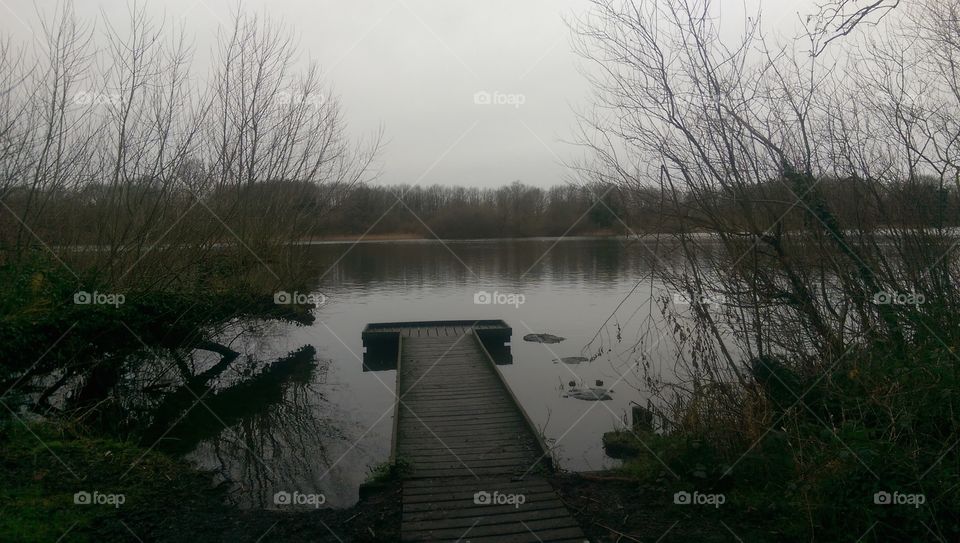 pier on lake in winter