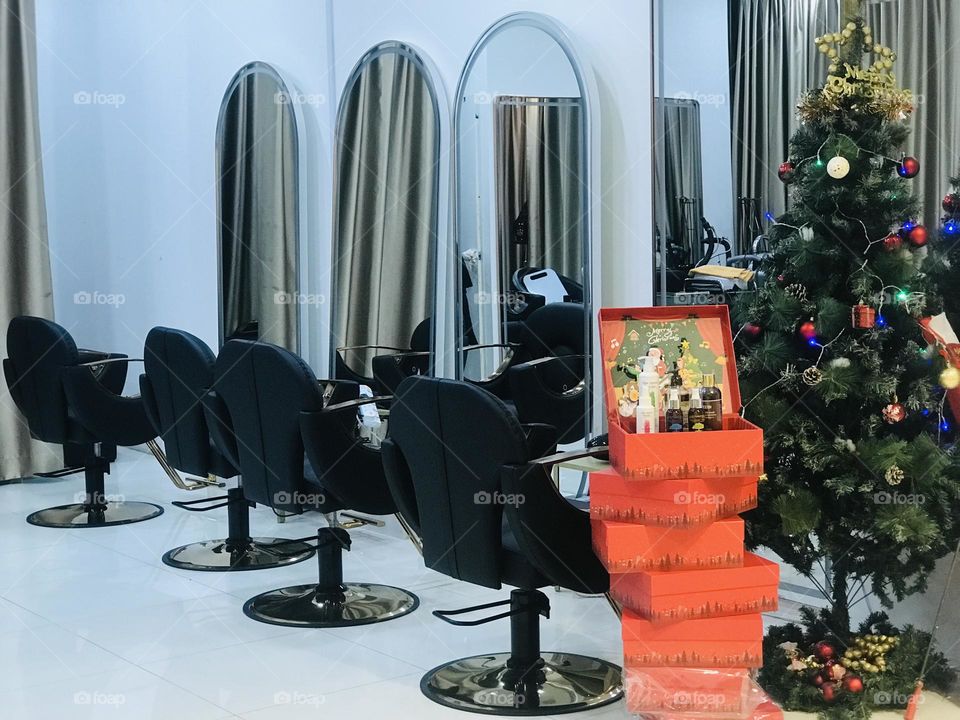 Beauty salon with Christmas tree and decoration 