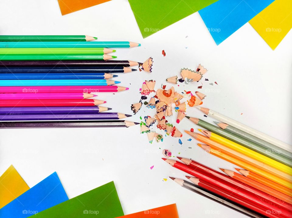 Back-to-school colors, crayons, colored paper and pencil shavings