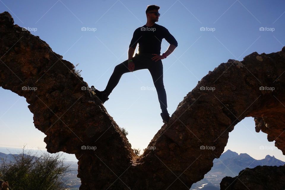 Sun#sky#human#boy#position#rocks