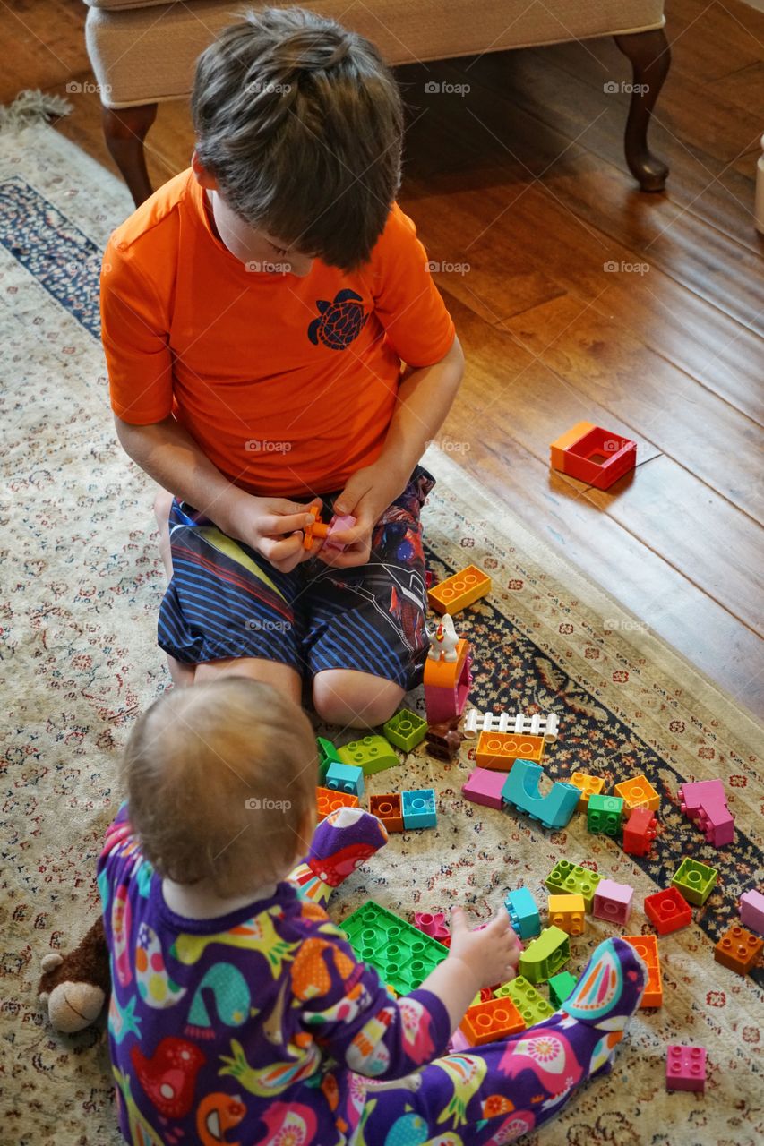 Young Boy Playing With Building Blocks