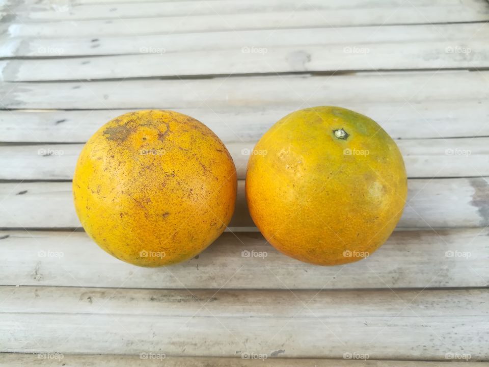 Fresh fruit, orange on wooden table.