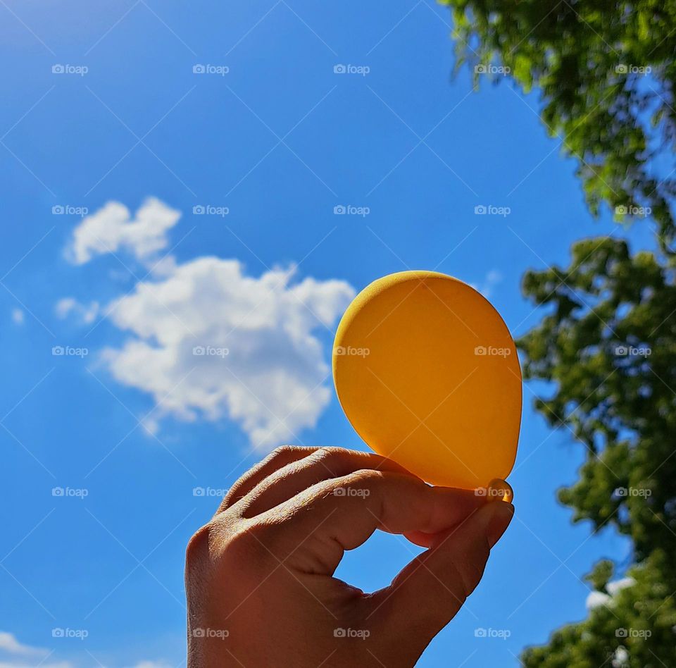 summer balloon in hand