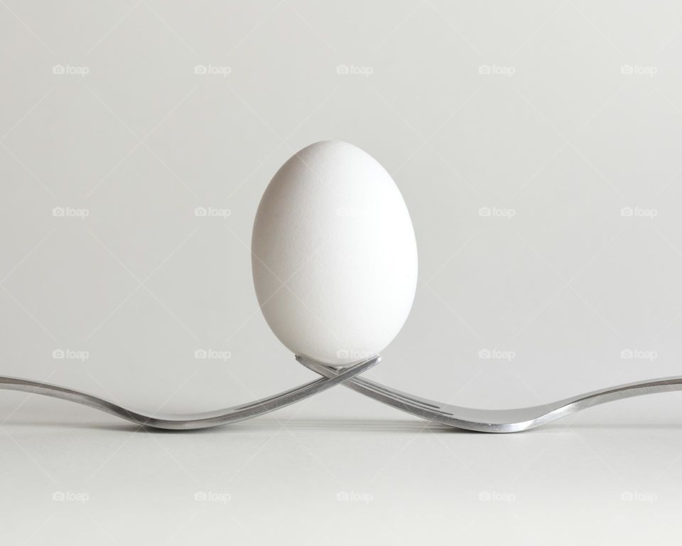 Egg balanced on fork
