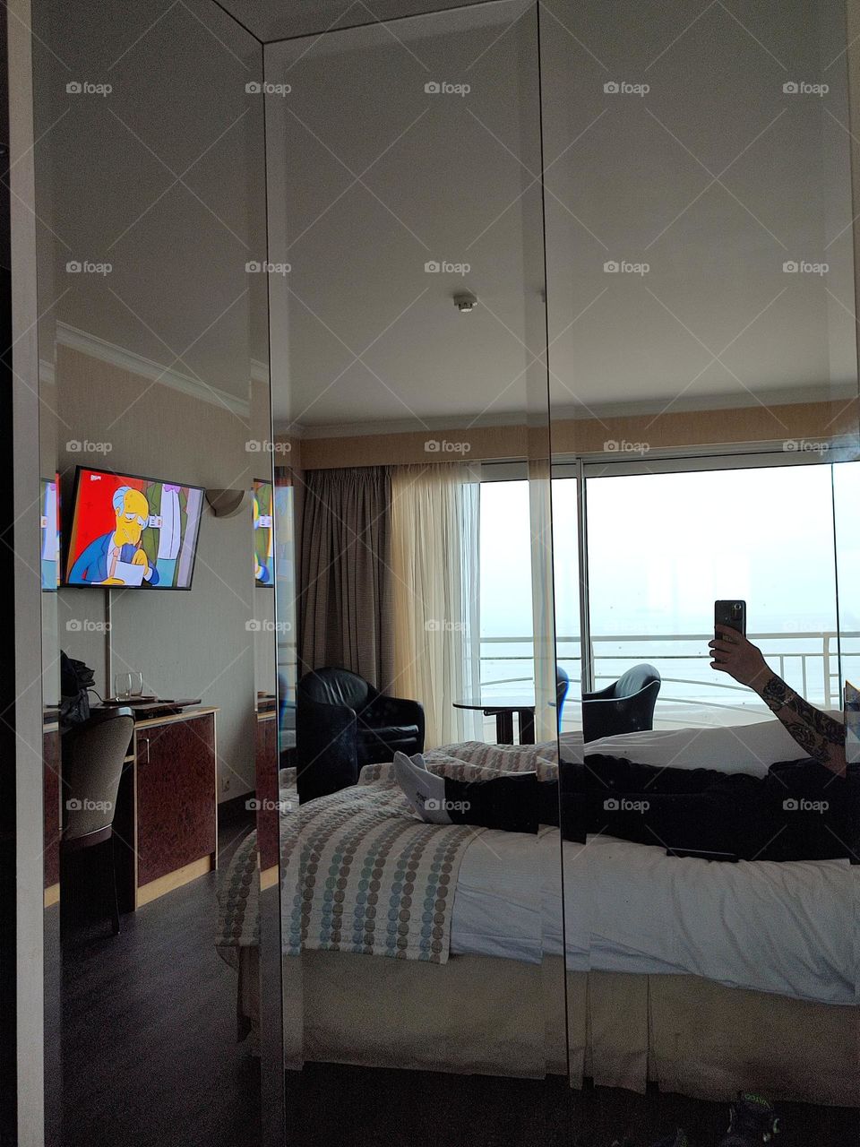 Morning in bed, sea view in front of the television.
