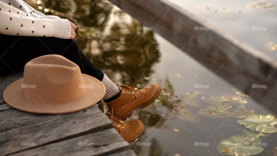 autumn macro photo of an autumn look made of women's clothes and shoes during a walk in nature