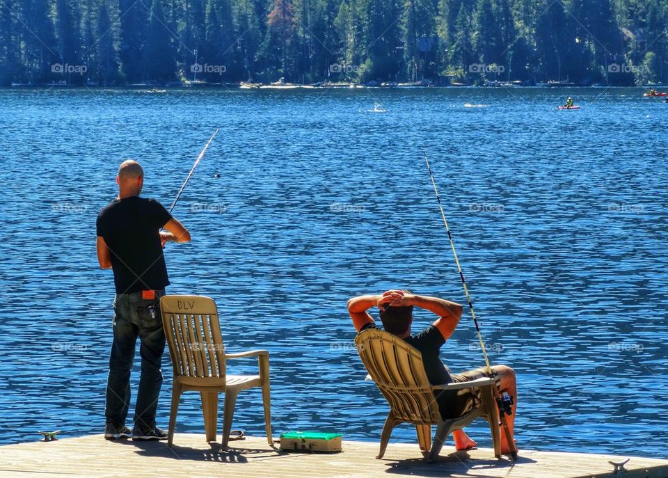 Fishing On A Forest Lake. Relaxing Pastime In The Summer

