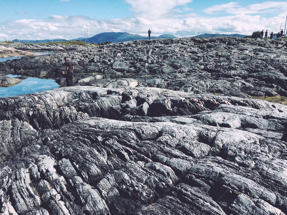 People standing on rock