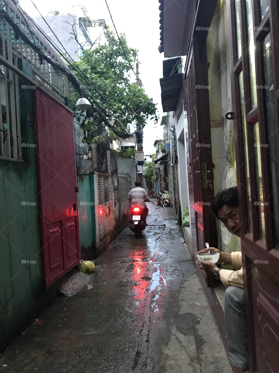 Motorbike in Vietnam • man eating rice 