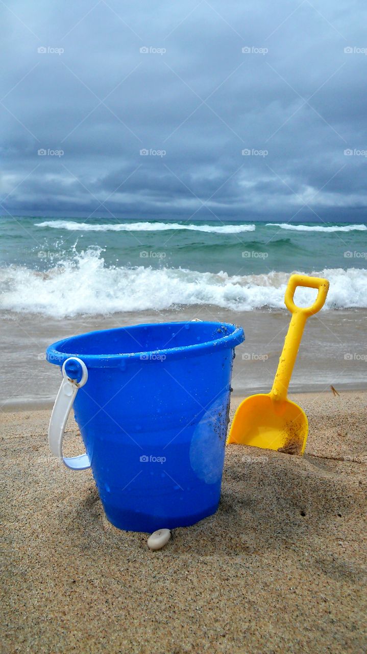 Bucket and shovel on the beach