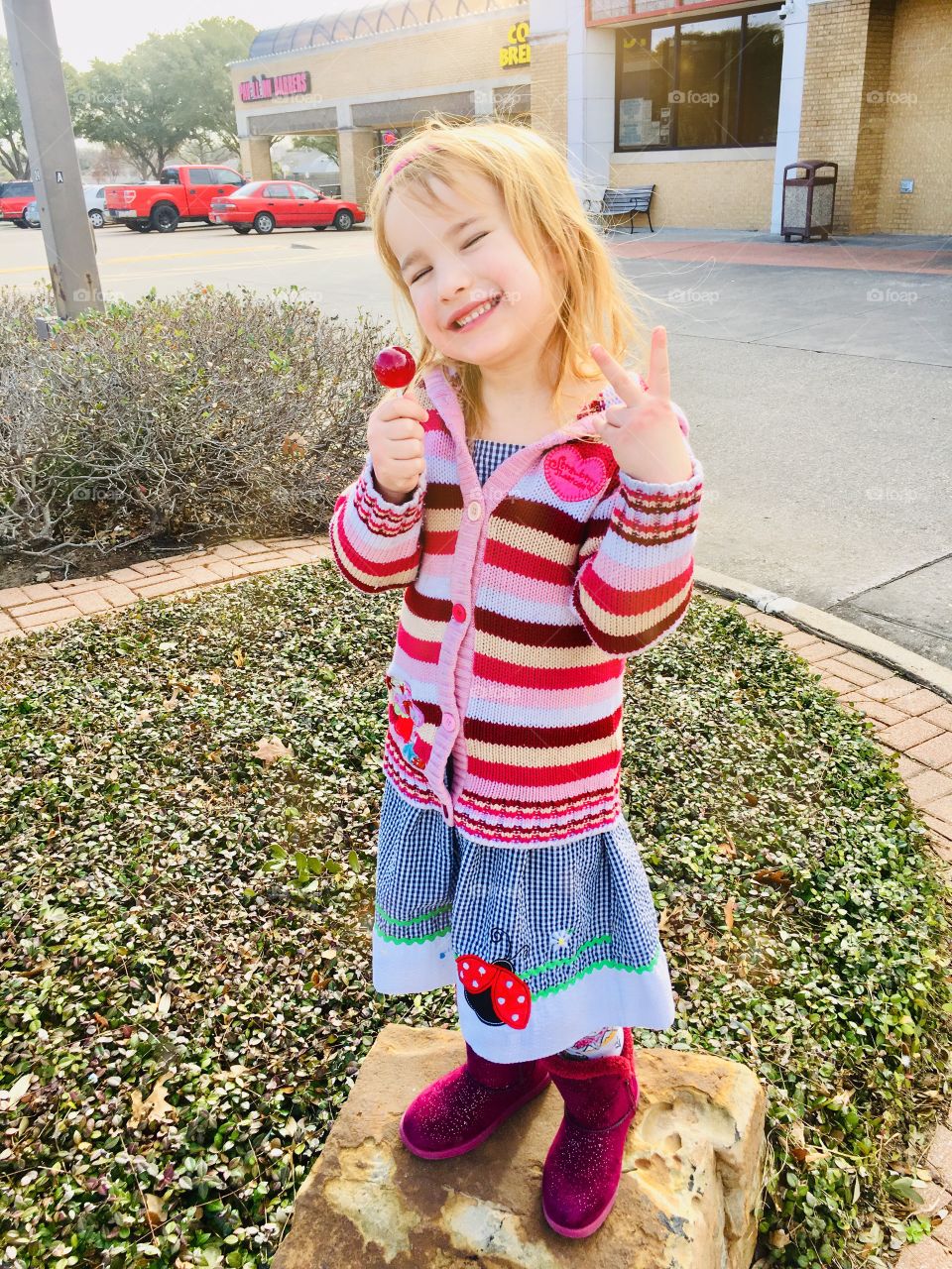 Girl holding a lollipop 