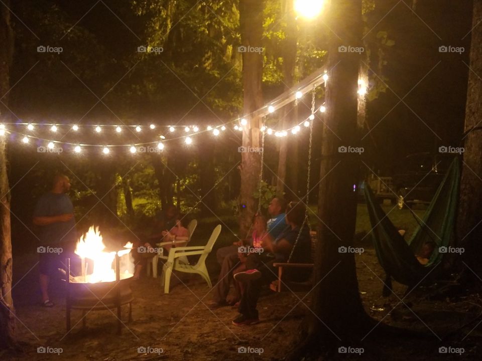 friends around campfire
